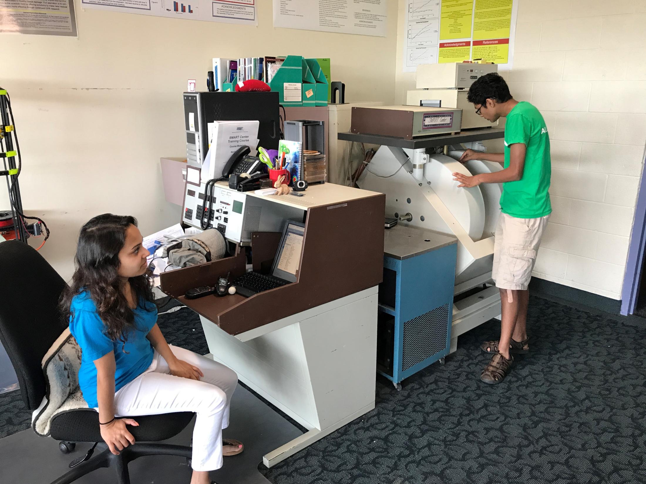 SMART Center students run a sample in a spectrometer.